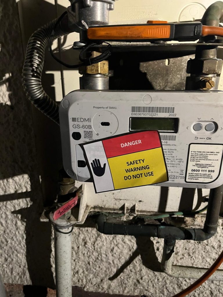 Gas meter with danger safety warning sticker after failed gas tightness test in Leeds